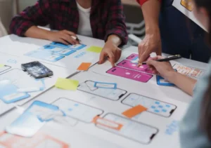 design team collaborating on mobile app user interface planning