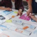 design team collaborating on mobile app user interface planning