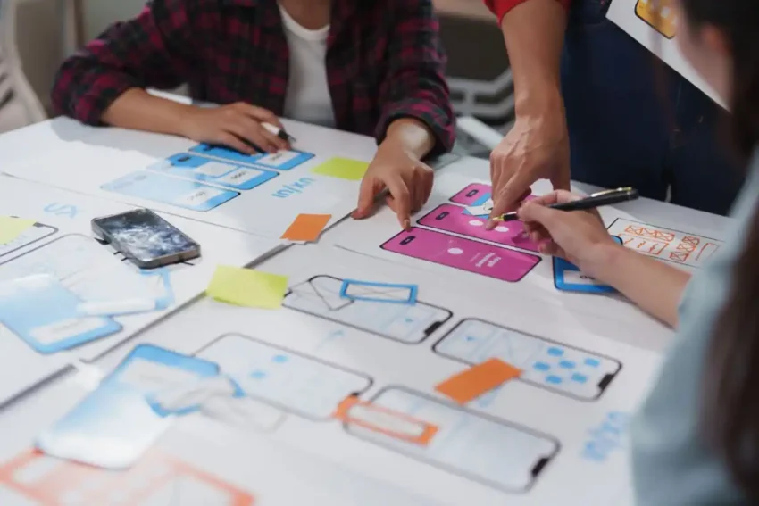 design team collaborating on mobile app user interface planning