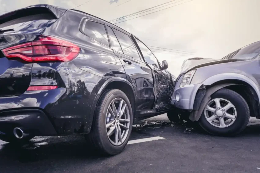two cars collided with visible side and front damage