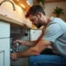 homeowner performing regular plumbing maintenance to improve home efficiency