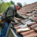 homeowner inspecting roof for damage signs and needed replacement