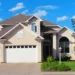 large modern suburban home with garage and landscaped yard