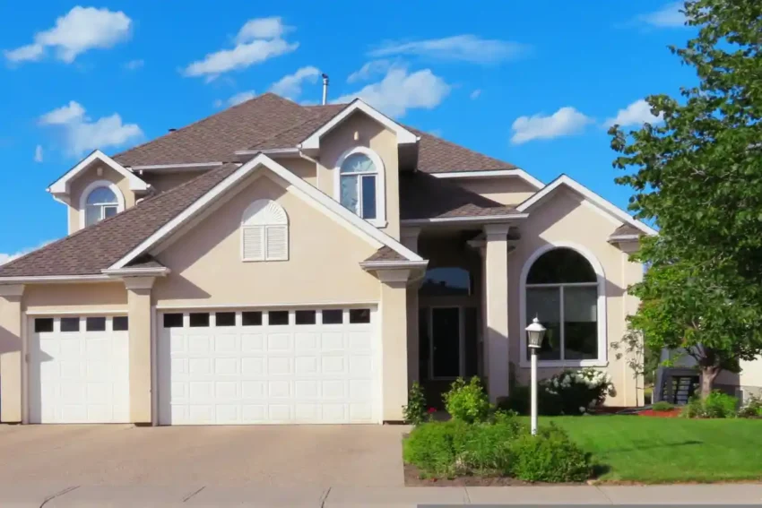 large modern suburban home with garage and landscaped yard