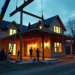 construction crew lifting large steel beams during home renovation